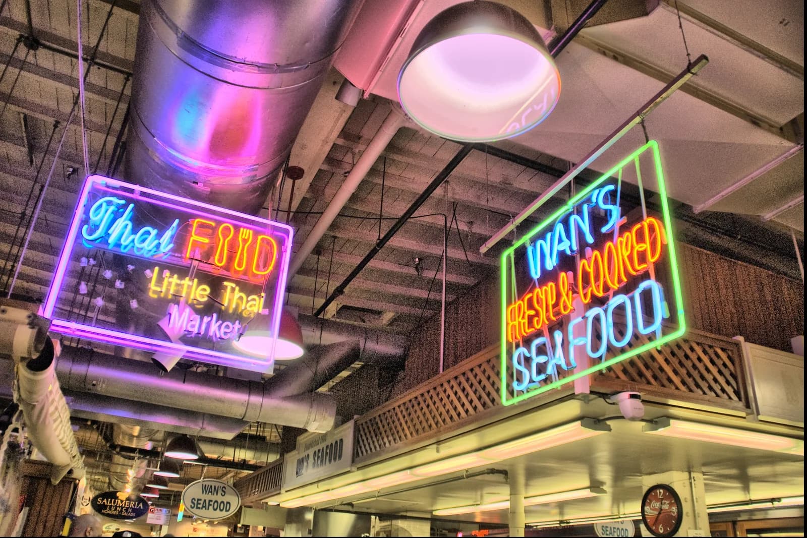 Neon food-vendor signs inside Philadelphia's Reading Terminal Market